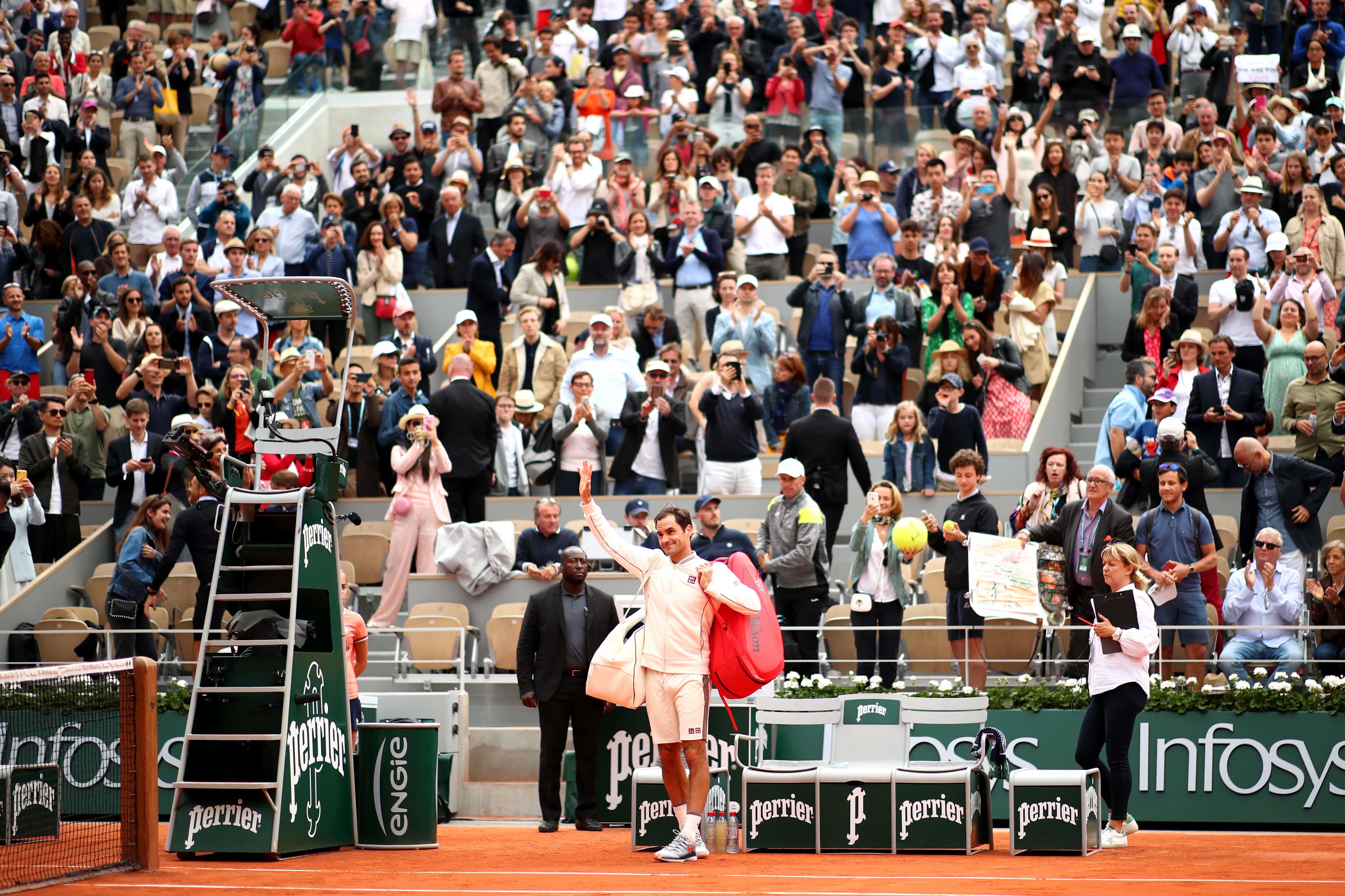 Roger Federer of Switzerland celebrates victory at the 2019 French Open at Roland Garros