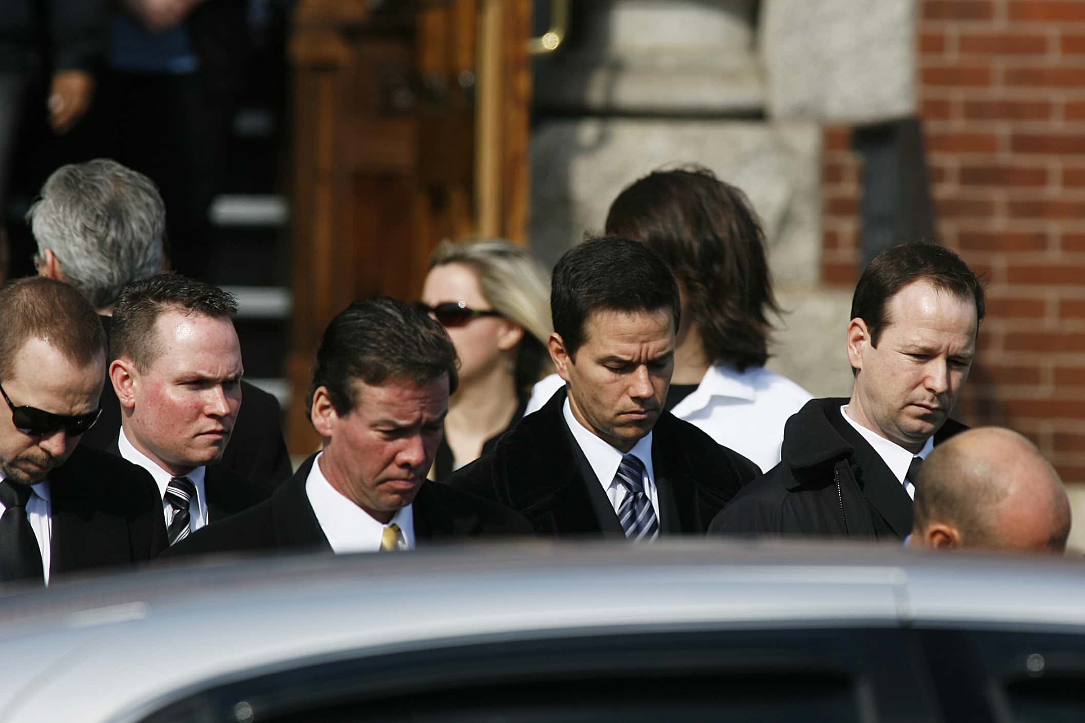 Actor Mark Wahlberg, second from right, carries the coffin of his father, Donald Wahlberg