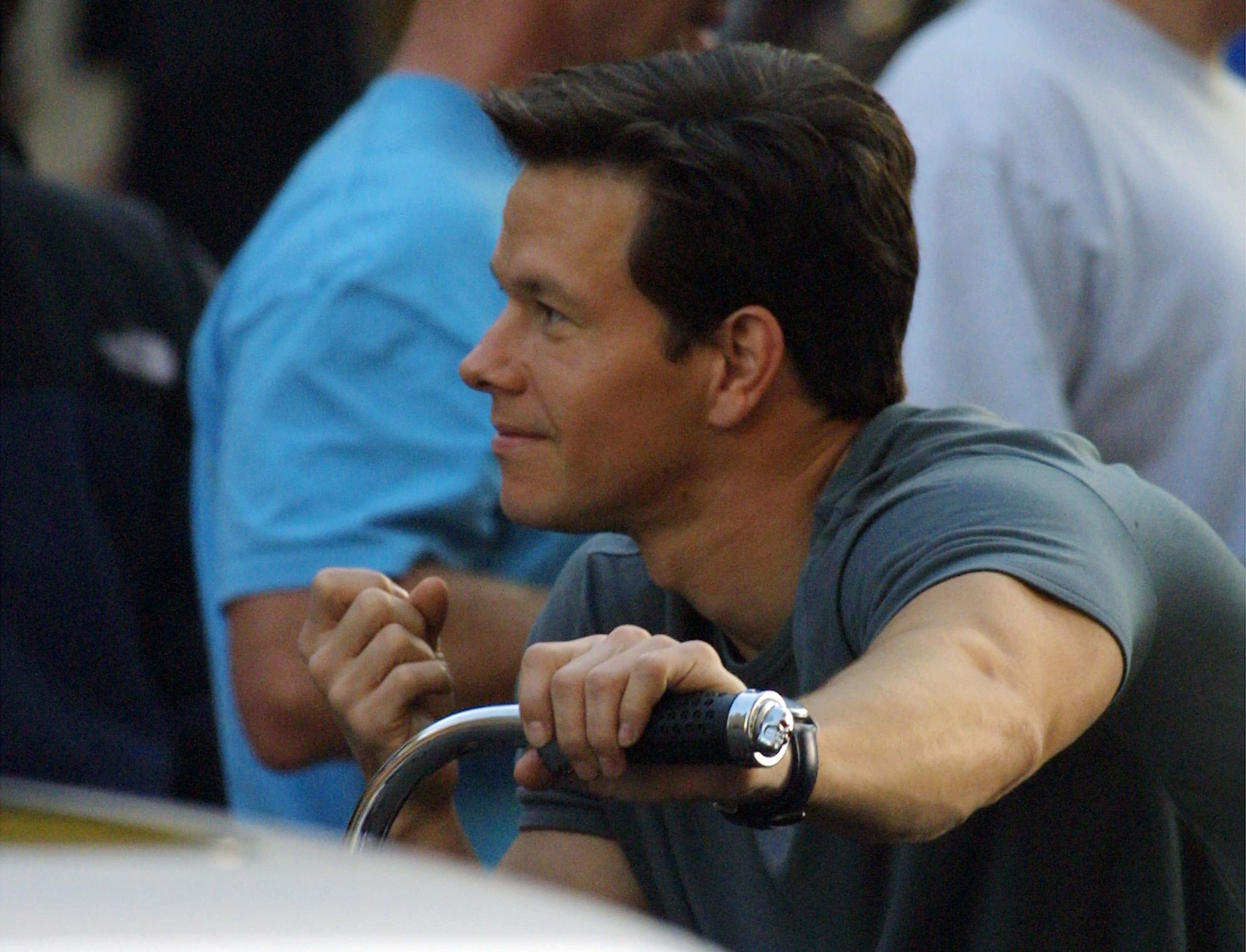 Actor Mark Wahlberg relaxes on a Dyno beach cruiser before shooting a scene on the set of "The Italian Job"