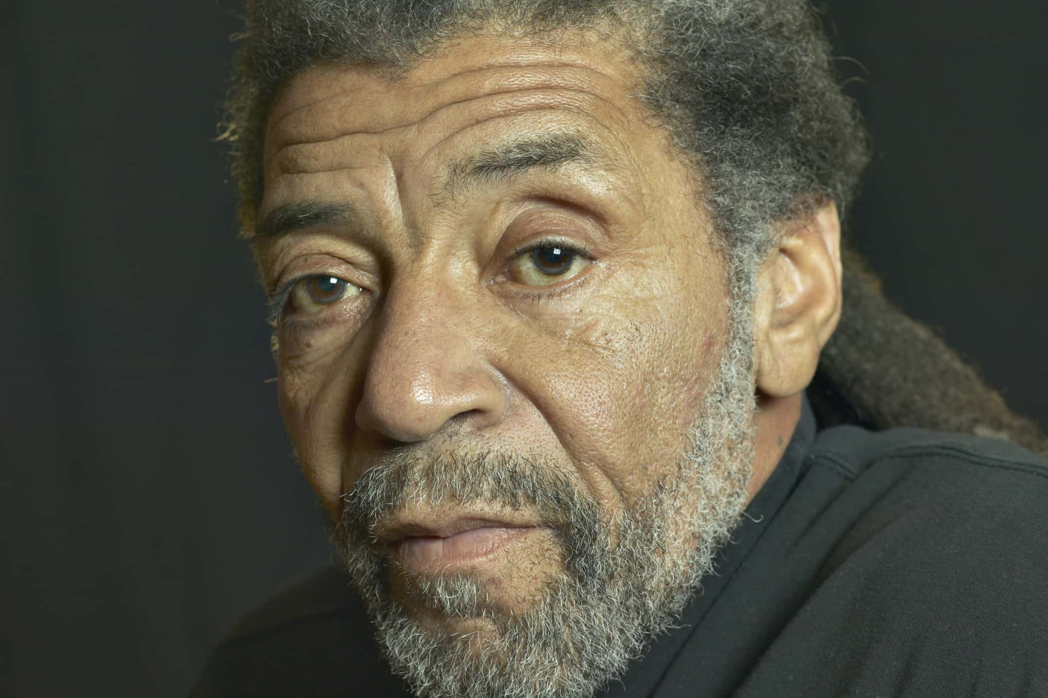 Close up portrait of an elderly musician.