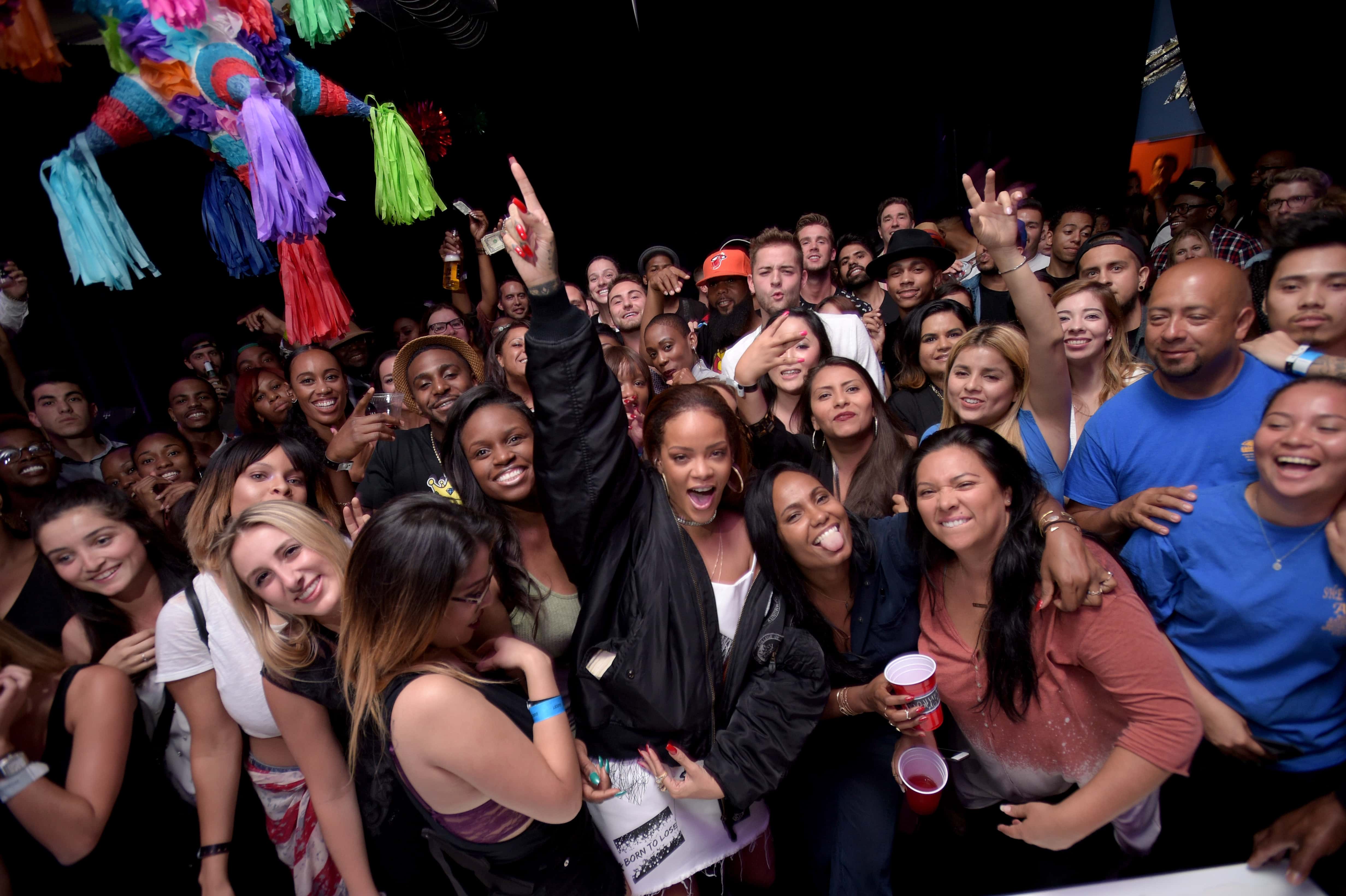Rihanna and fans enjoy the TIDAL X: RIHANNA BBHMM event on July 1, 2015