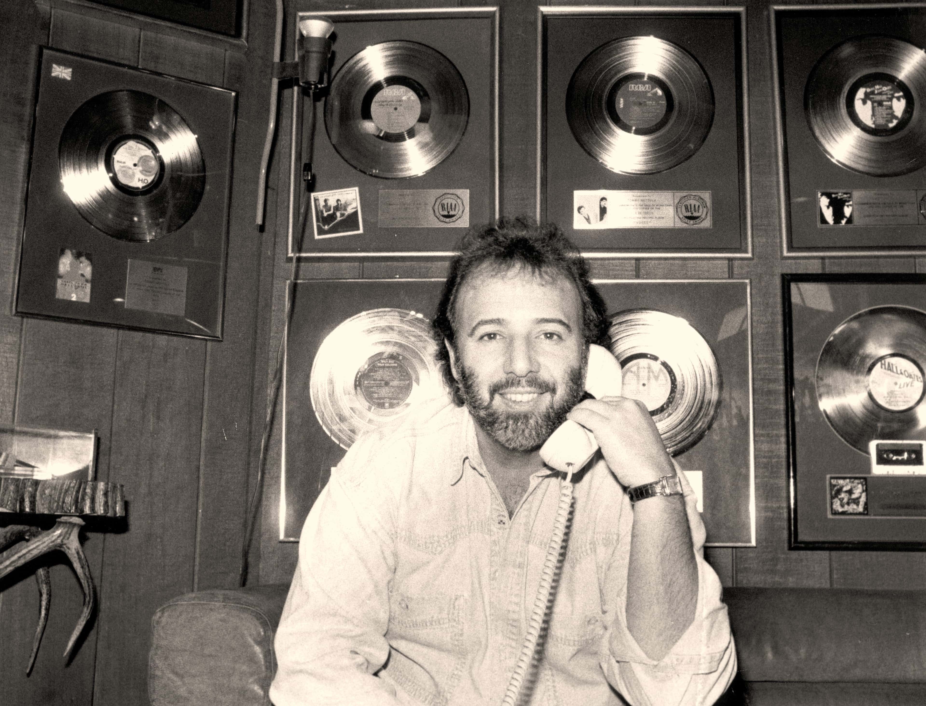 Tommy Mottola wearing a white shirt