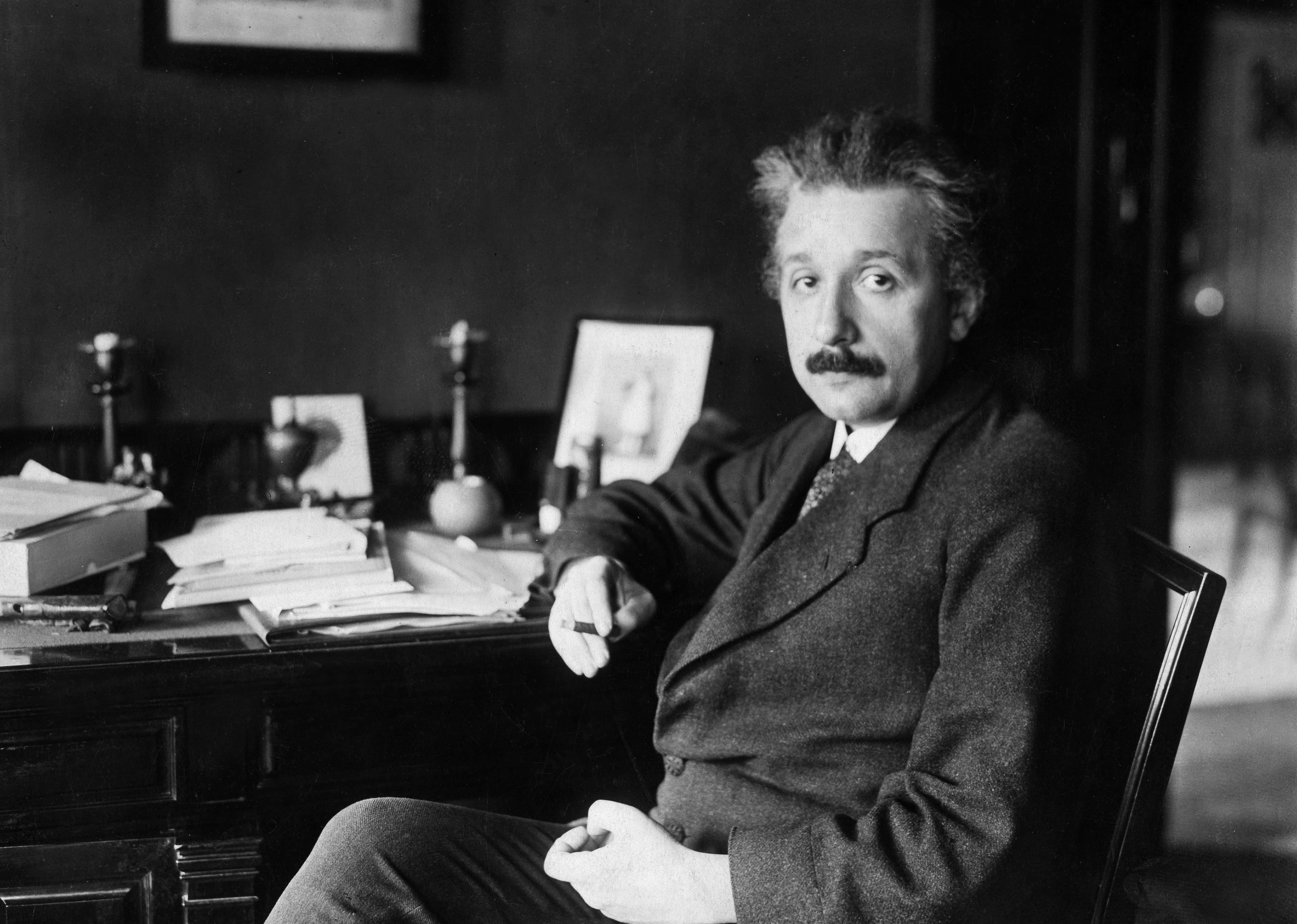 Einstein, Albert - Physicist, Germany/USA, at his desk.
