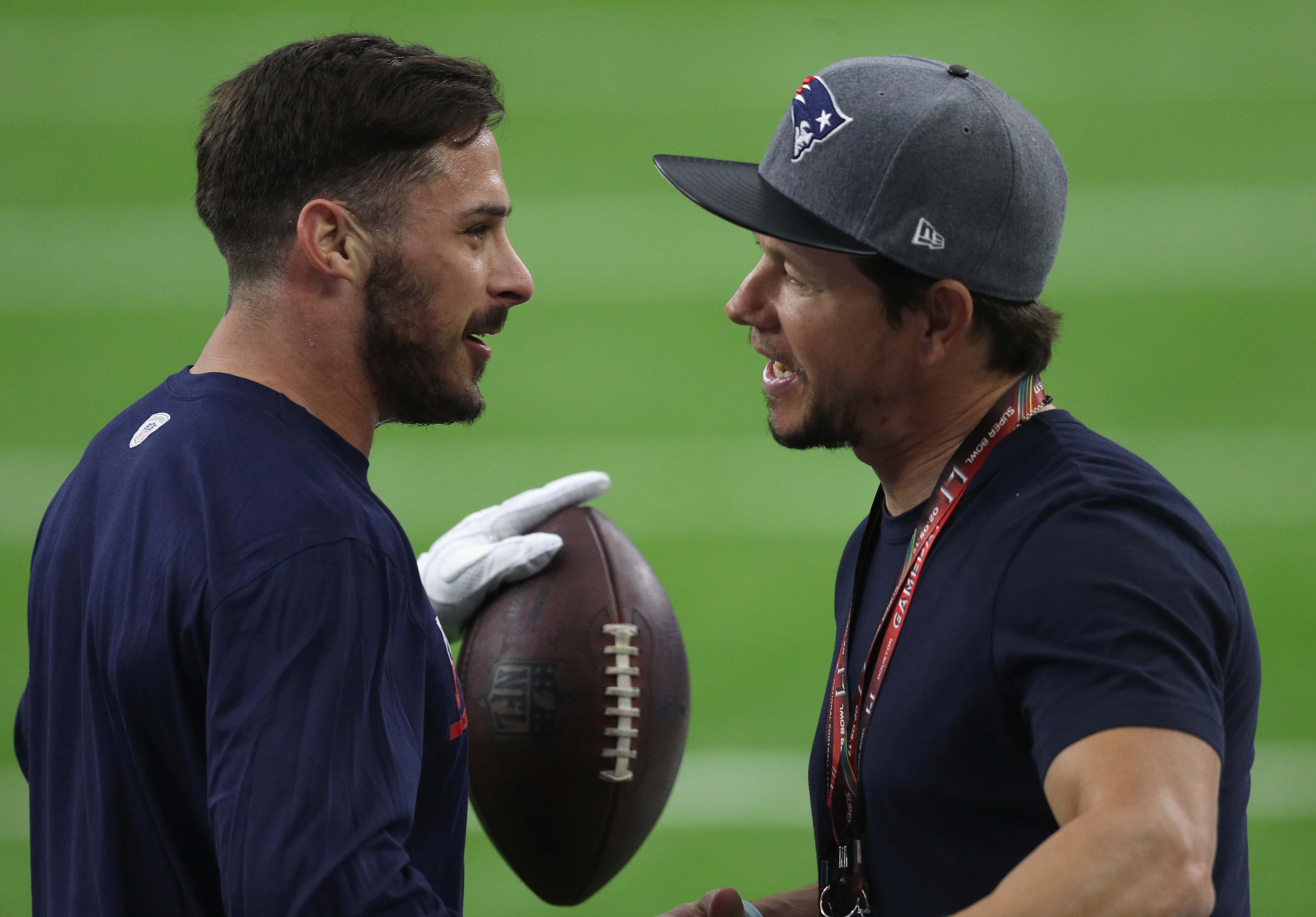 Danny Amendola #80 of the New England Patriots speaks to actor Mark Wahlberg prior to Super Bowl 51