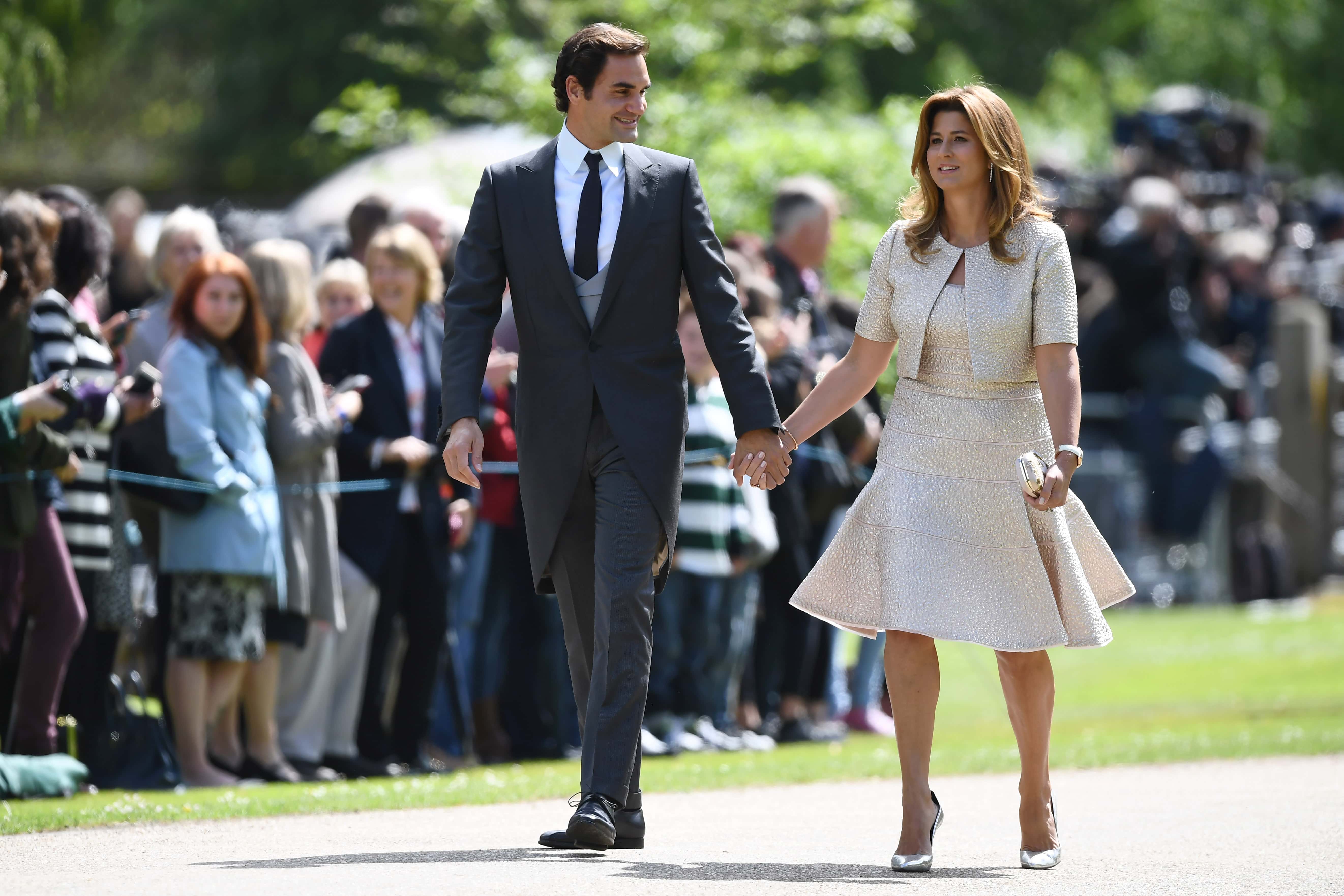 Swiss tennis player Roger Federer (L) and his wife Mirka