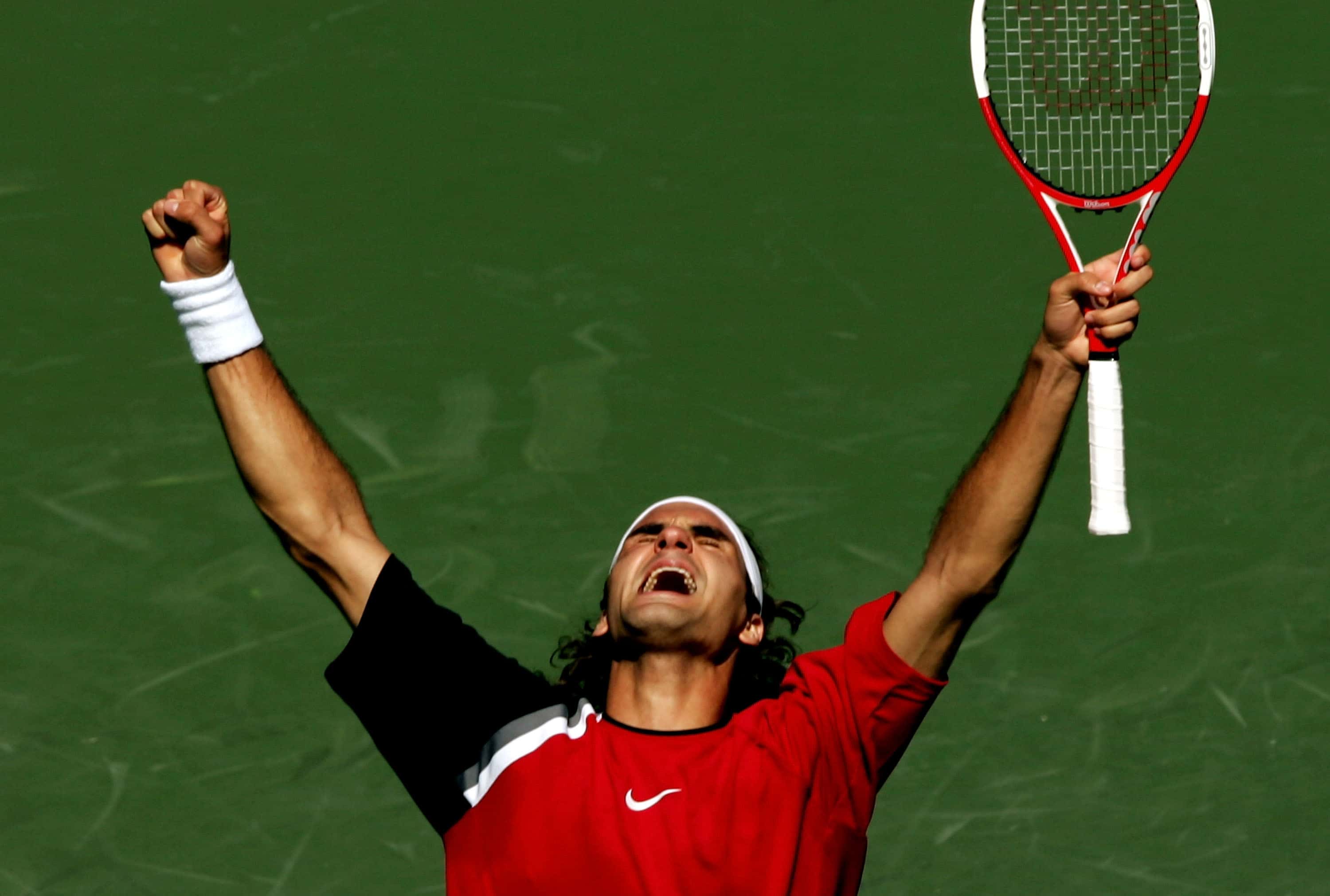 Roger Federer of Switzerland celebrates match point after defeating Rafael Nadal of Spain
