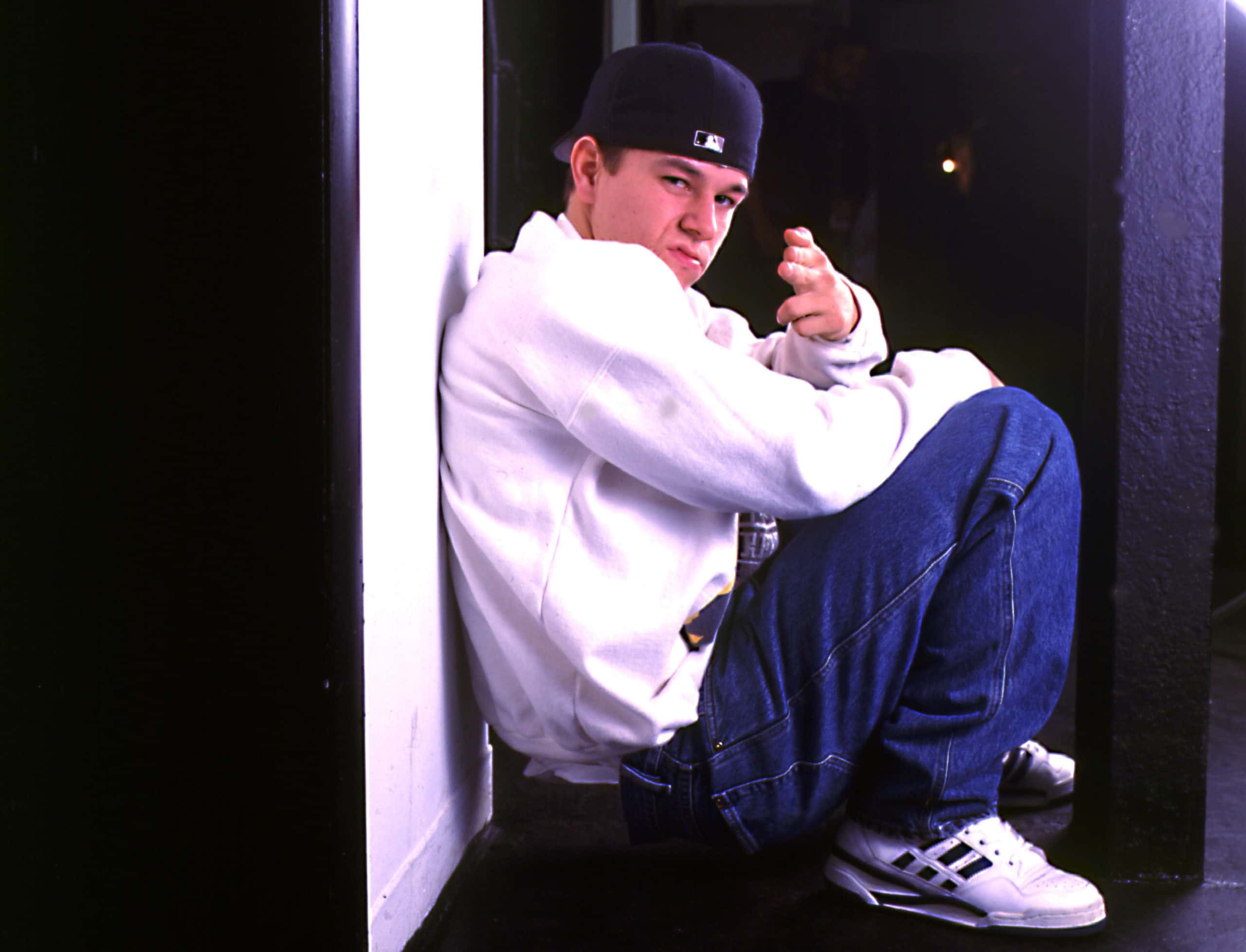 Portrait Photo of Marky Mark sitting on a floor