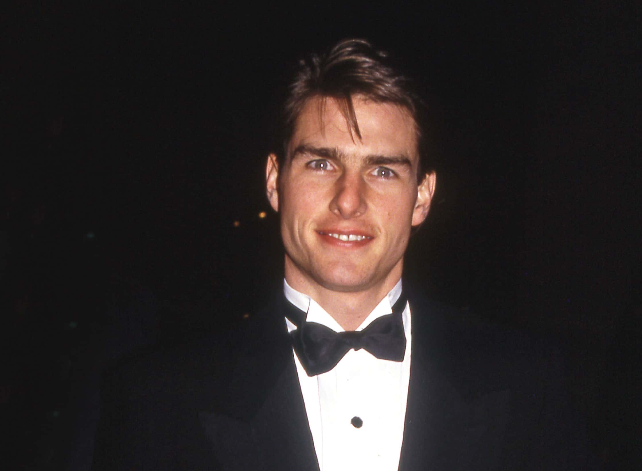 Tom Cruise wearing a black suit