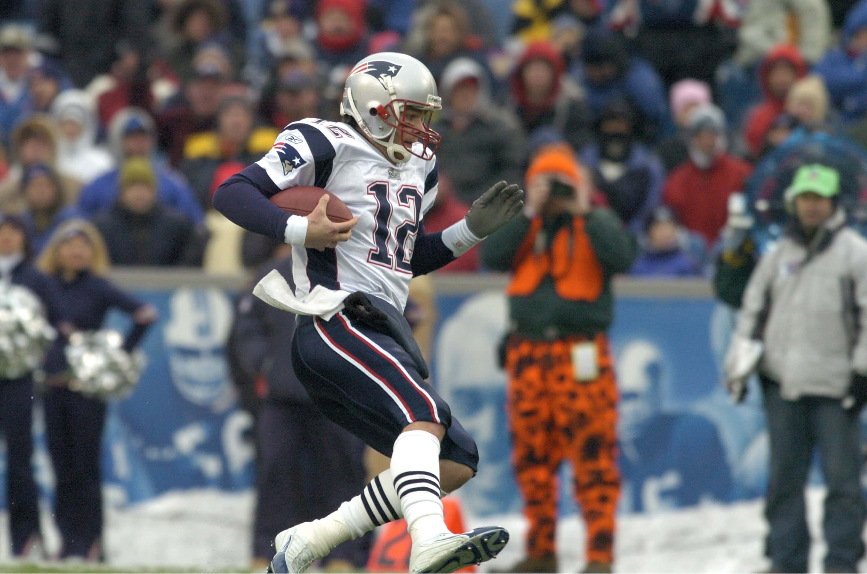 Tom Brady runs for a first down during a game against the Buffalo Bills at Ralph Wilson Stadium