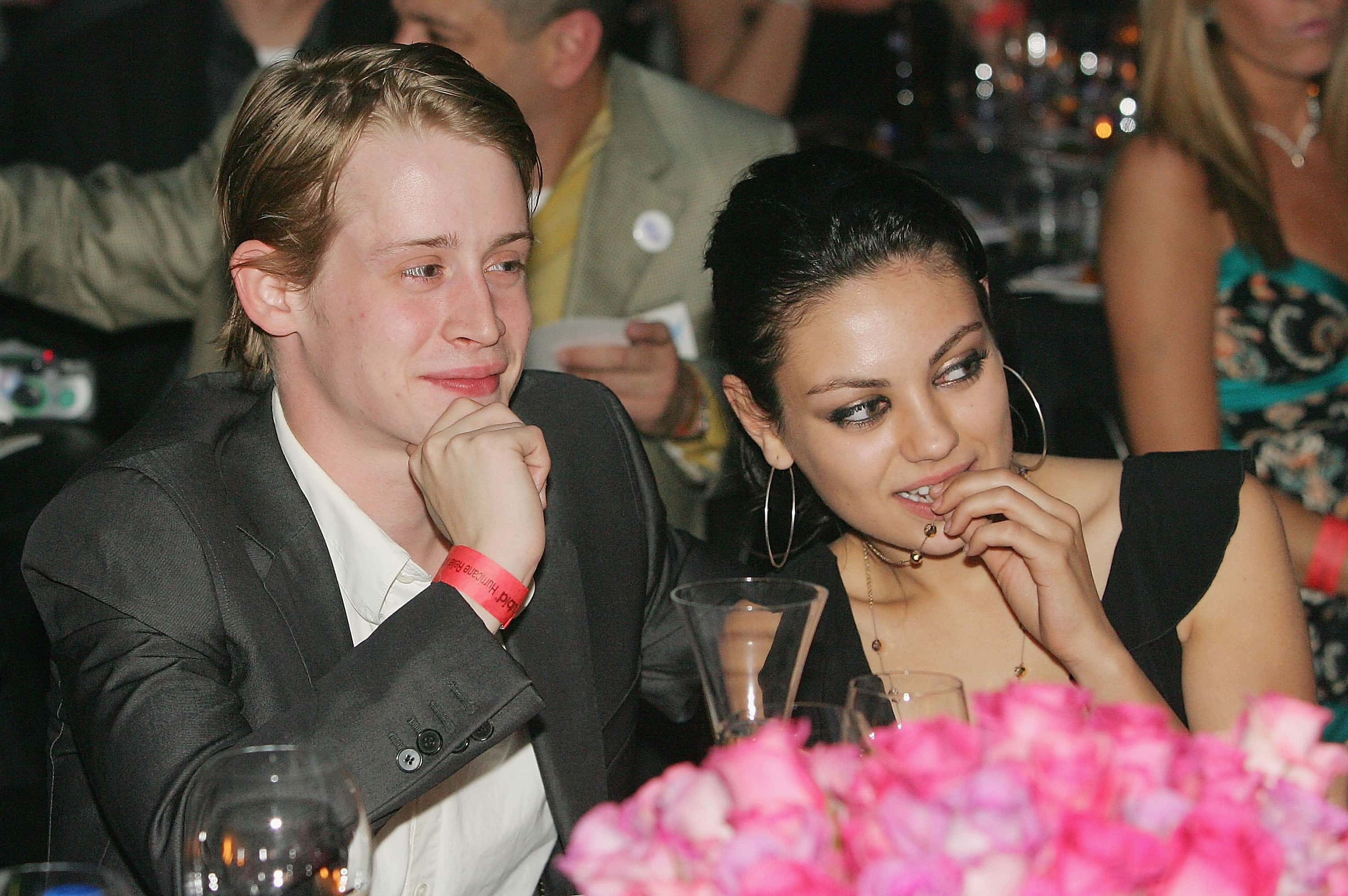 Actor Macaulay Culkin (L) and actress Mila Kunis