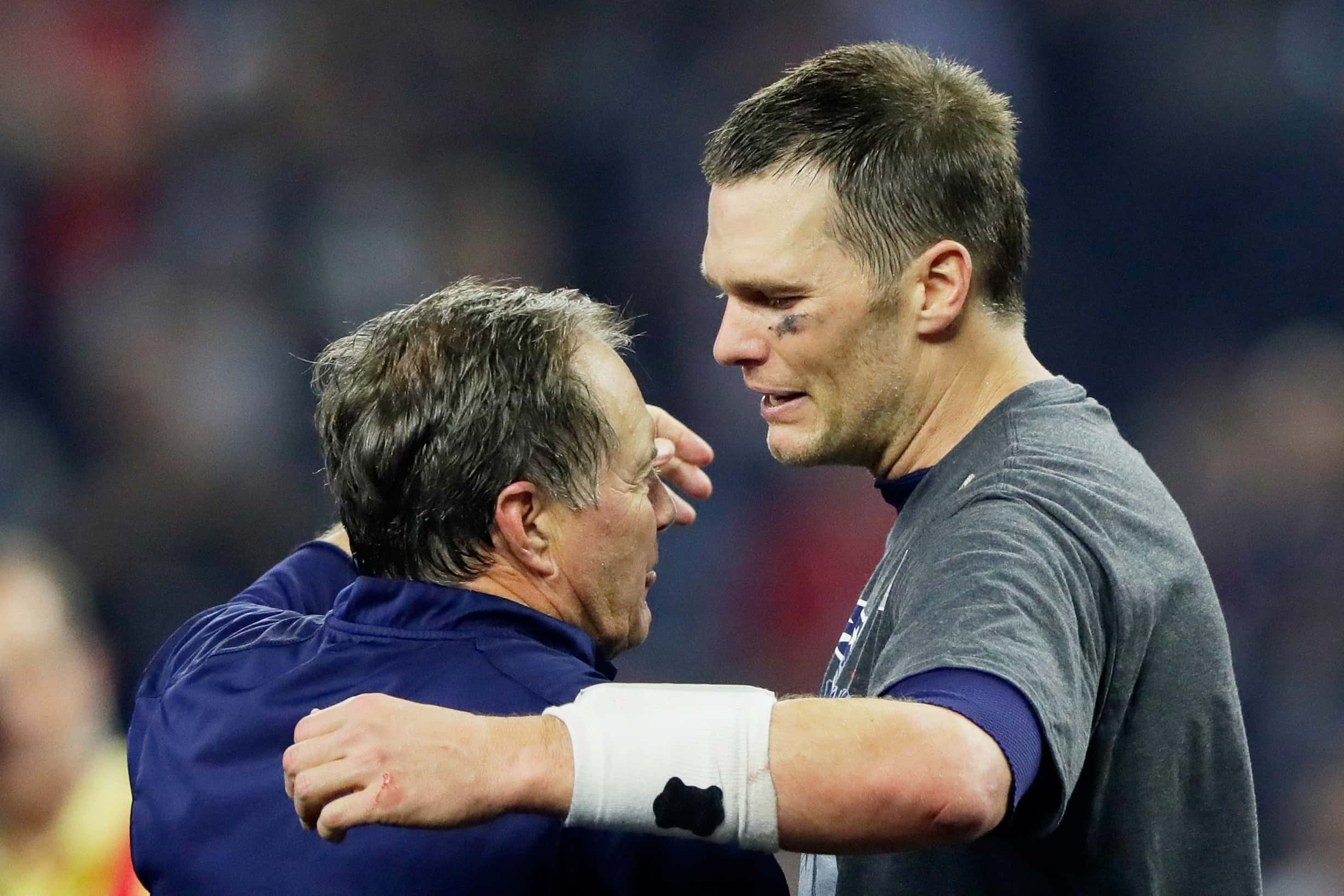 Head coach Bill Belichick of the New England Patriots and Tom Brady #12