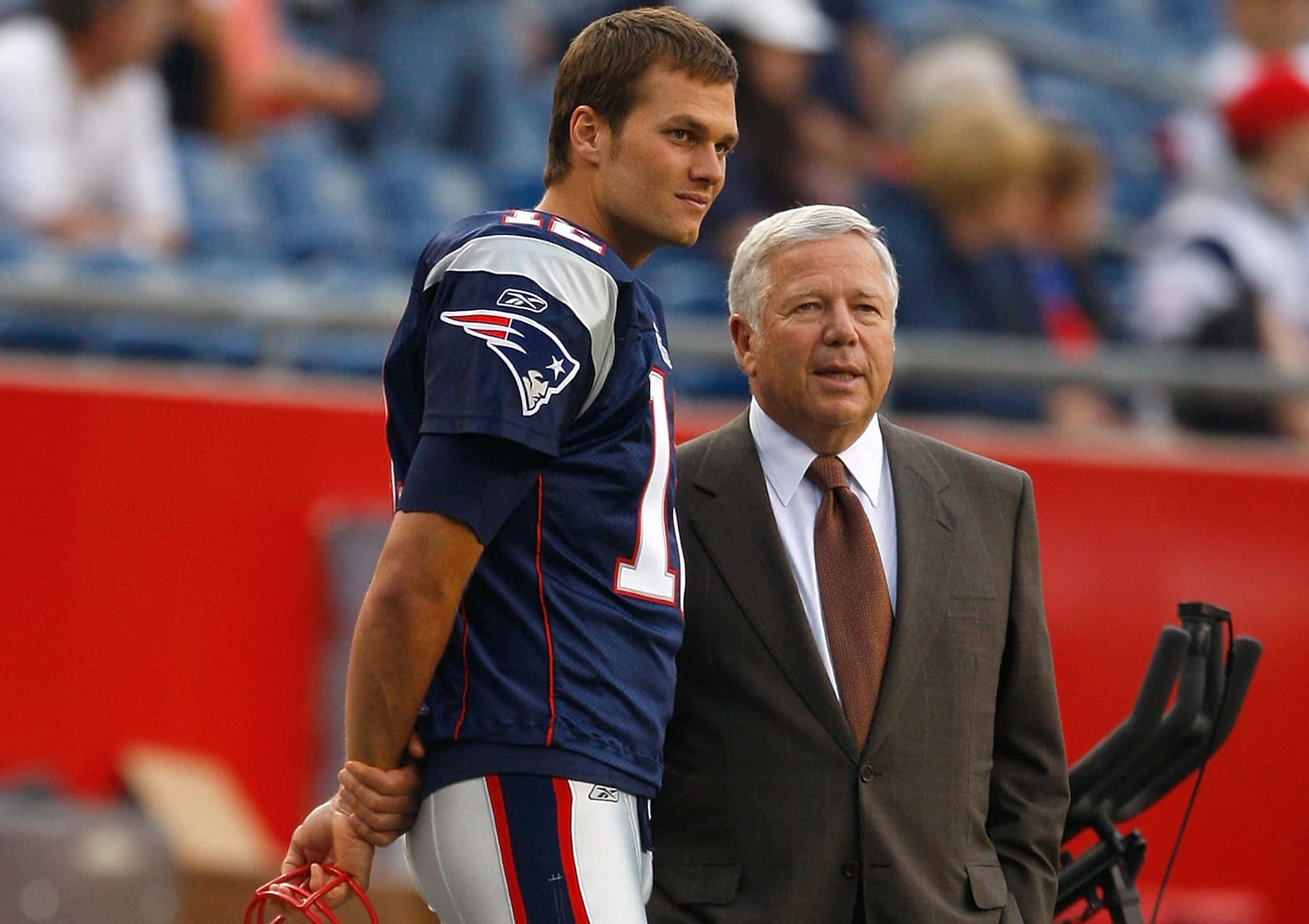 Tom Brady #12 of the New England Patriots chats with team owner Robert Kraft