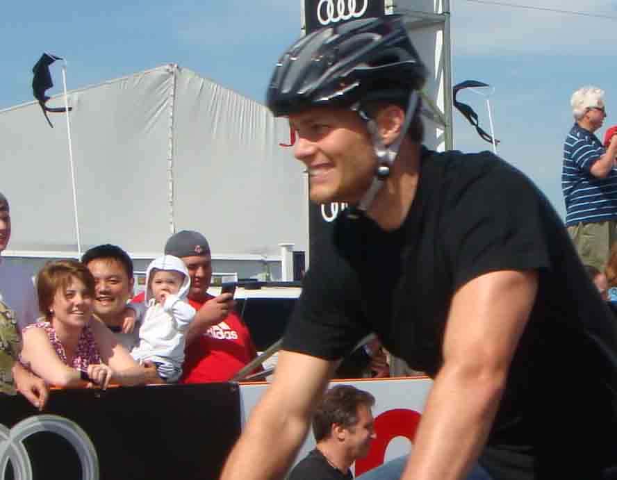 Tom Brady riding a bicycle at "Buddy Ride"