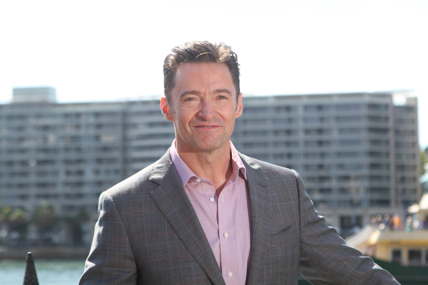 Hugh Jackman wearing pink shirt