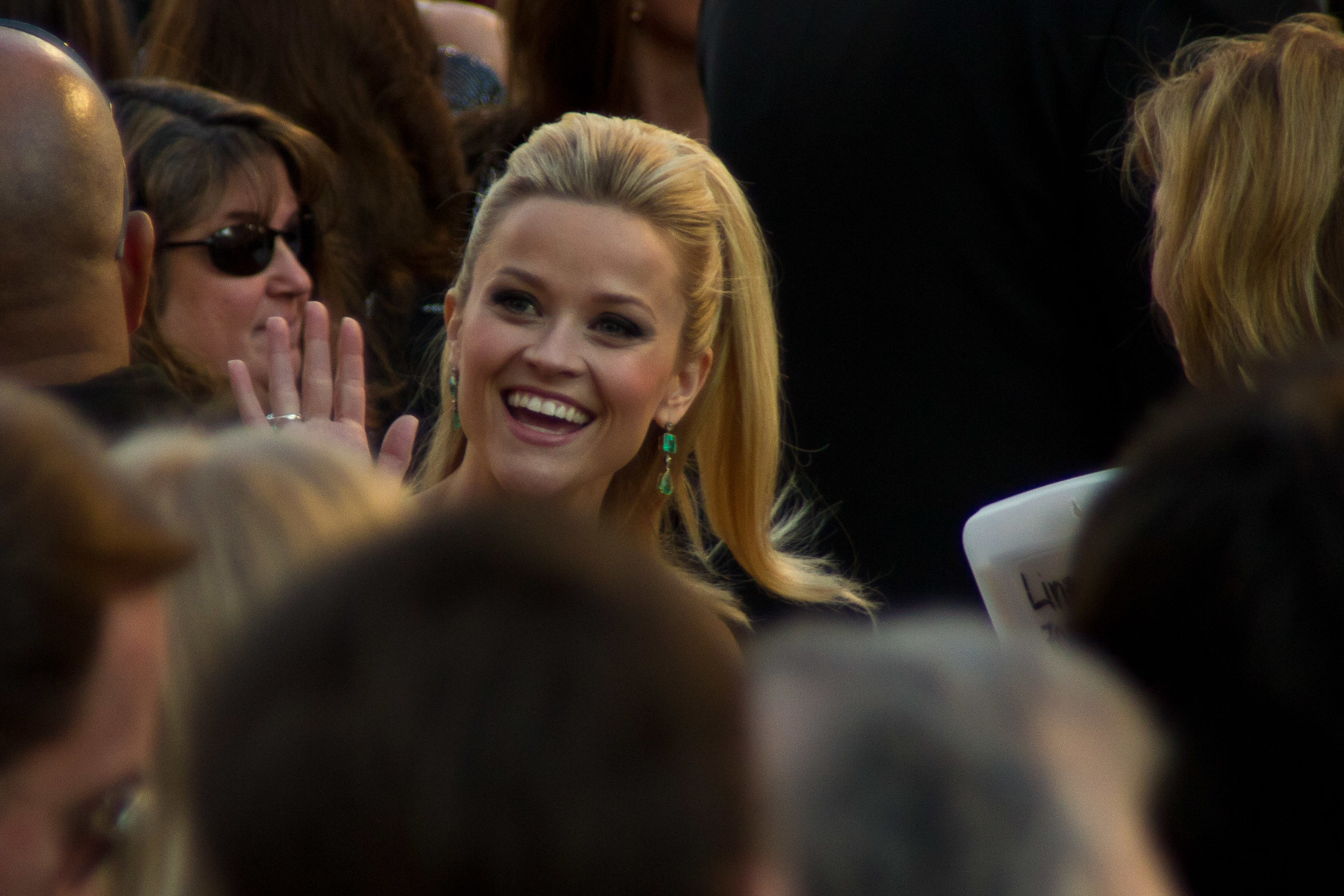 Reese Witherspoon waving at fans