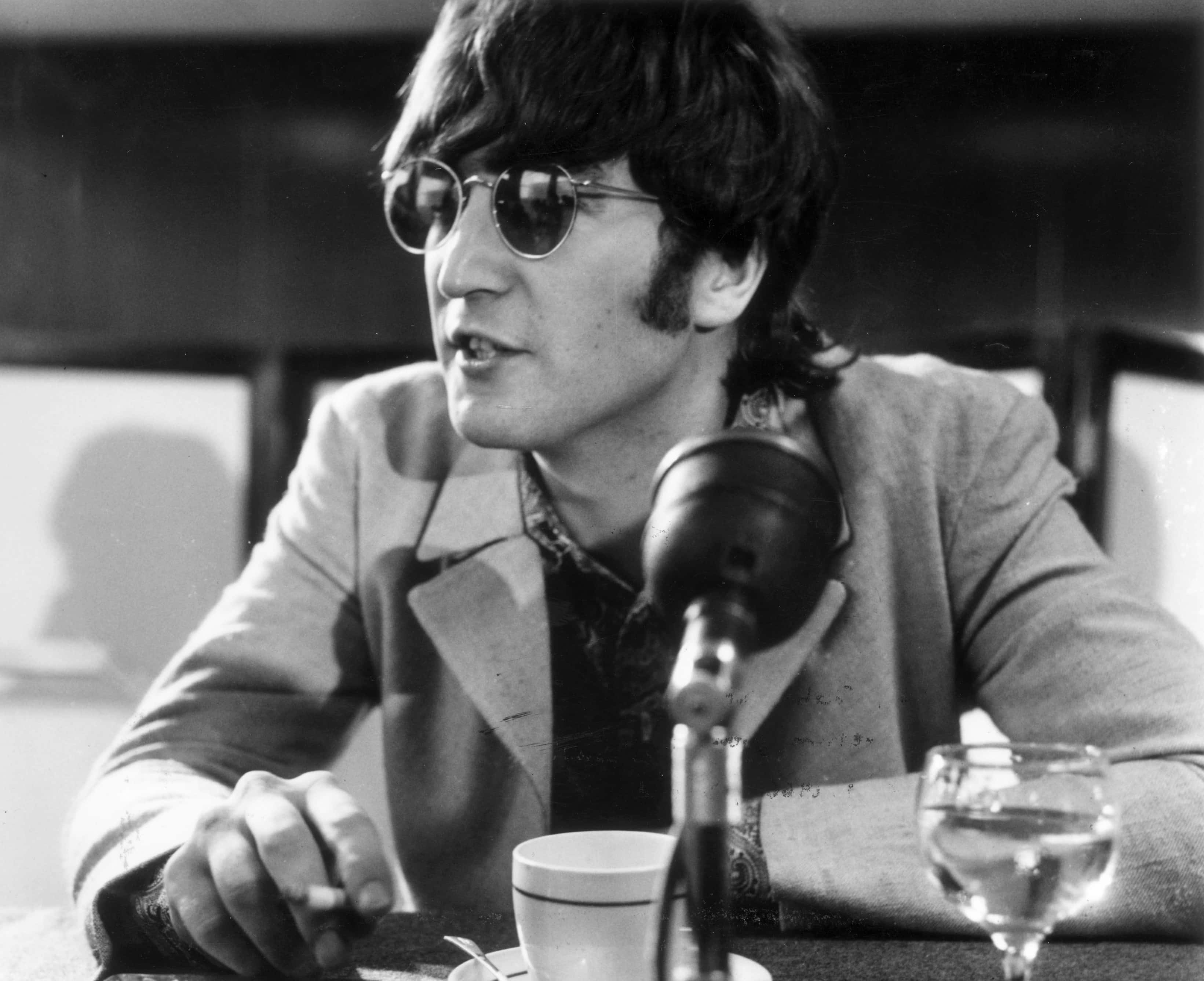 English pop star John Lennon (1940 - 1980) at a press conference