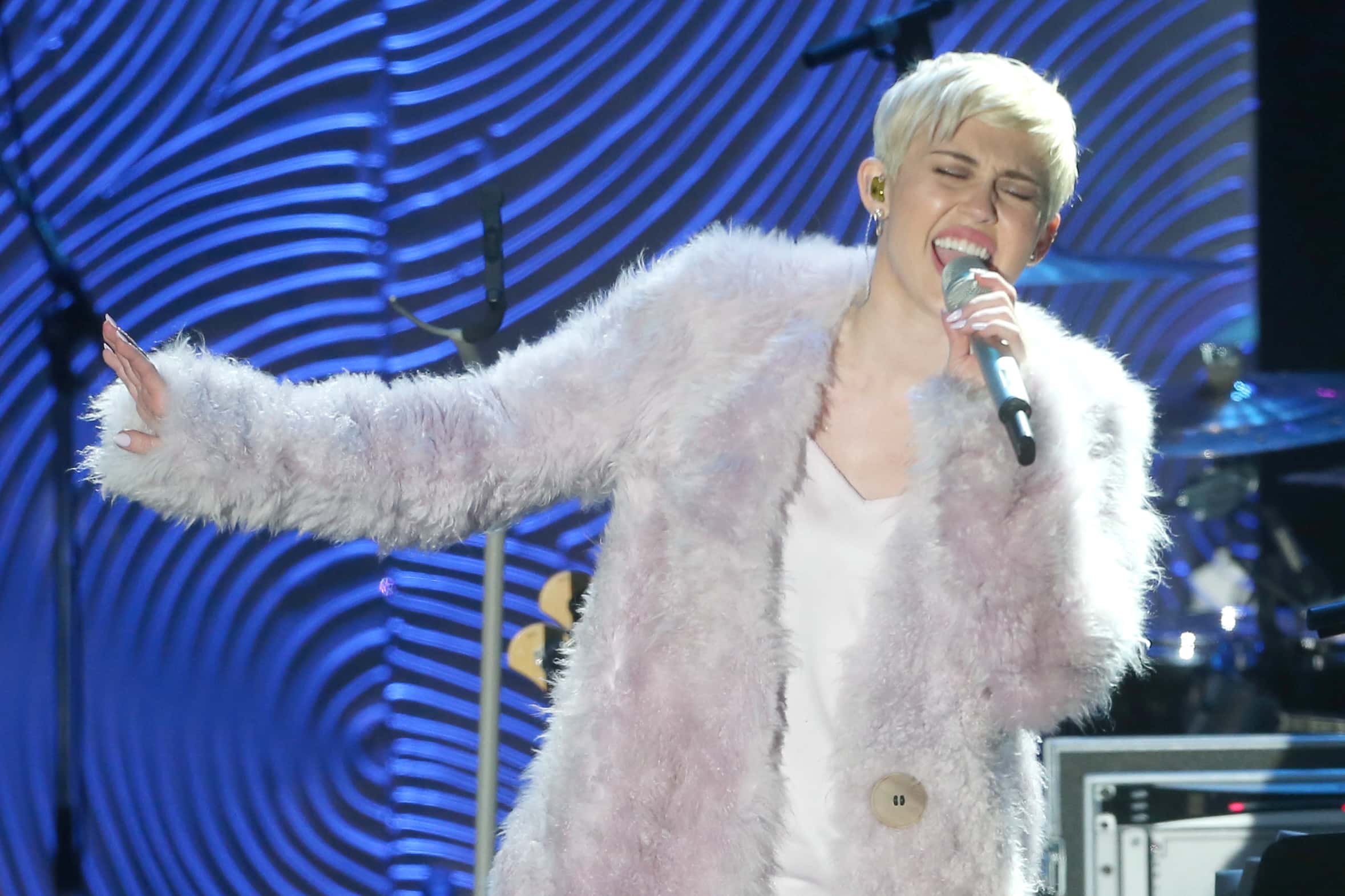 Singer Miley Cyrus performs onstage during the 56th annual GRAMMY Awards