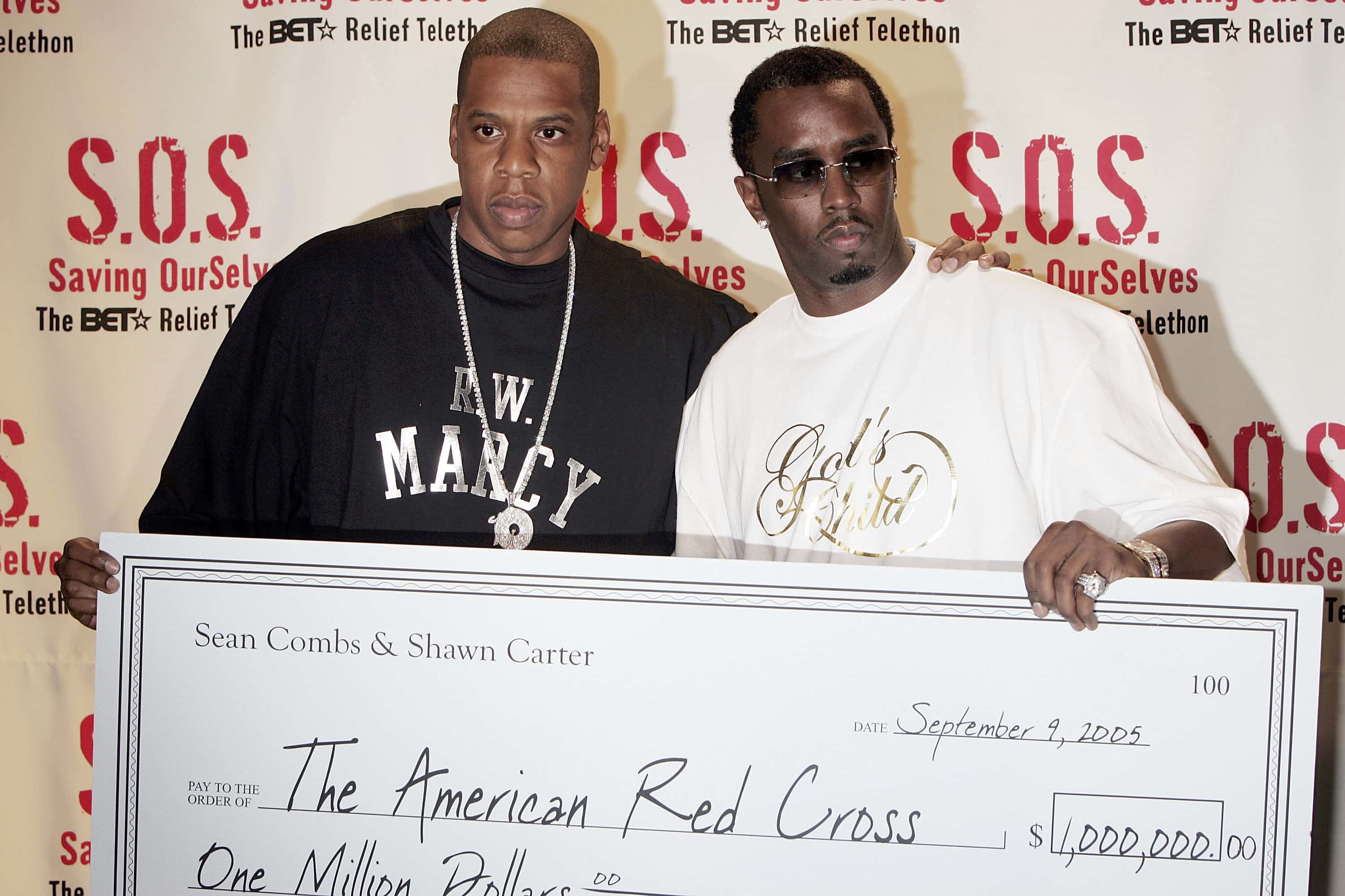 Rappers Jay-Z (L) and Sean "P. Diddy" Combs donation