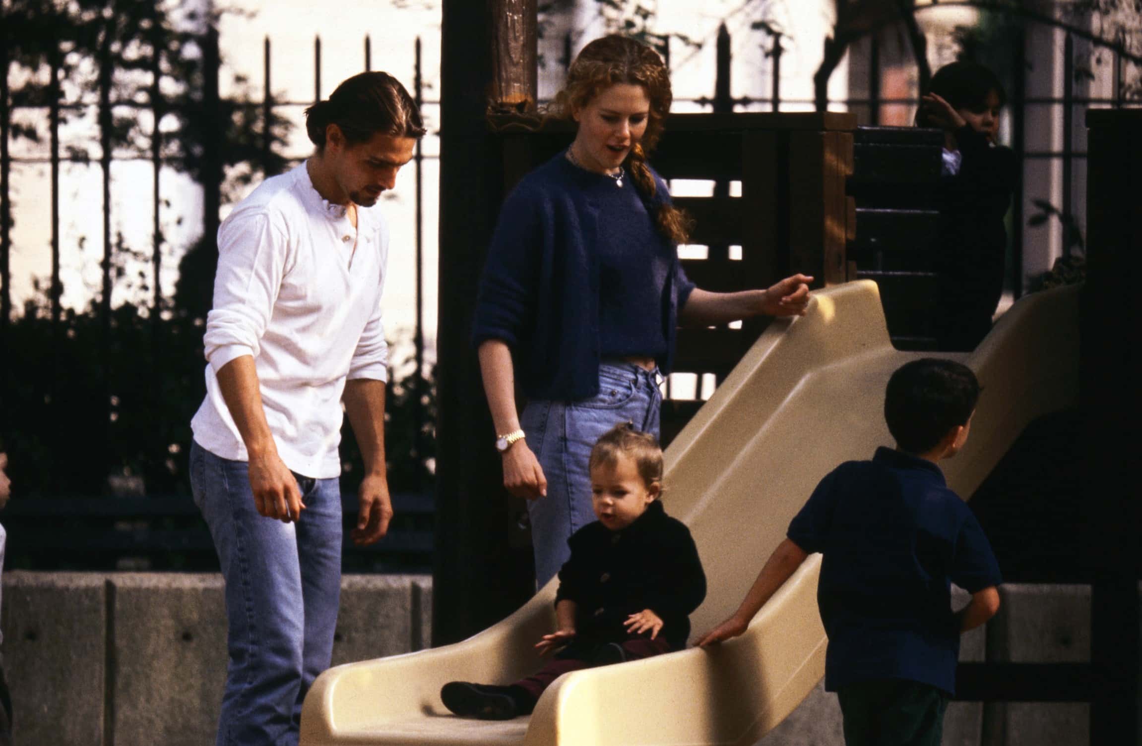Nicole Kidman and Tom Cruise play with their daughter