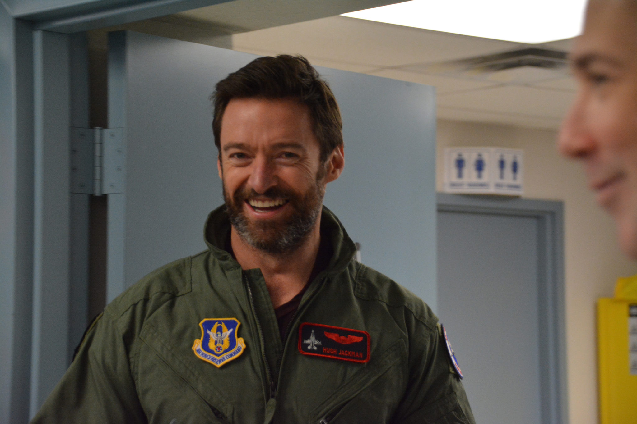 Hugh Jackman, “Eddie the Eagle” star, is all smiles Feb. 19 while getting ready for his flight here in an F-16. Jackman