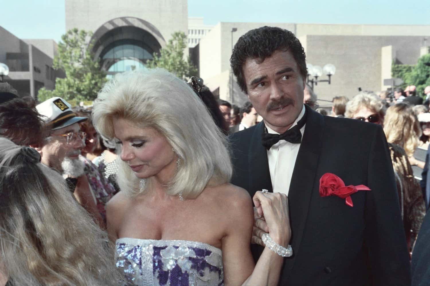 Loni Anderson and Burt Reynolds holding hands