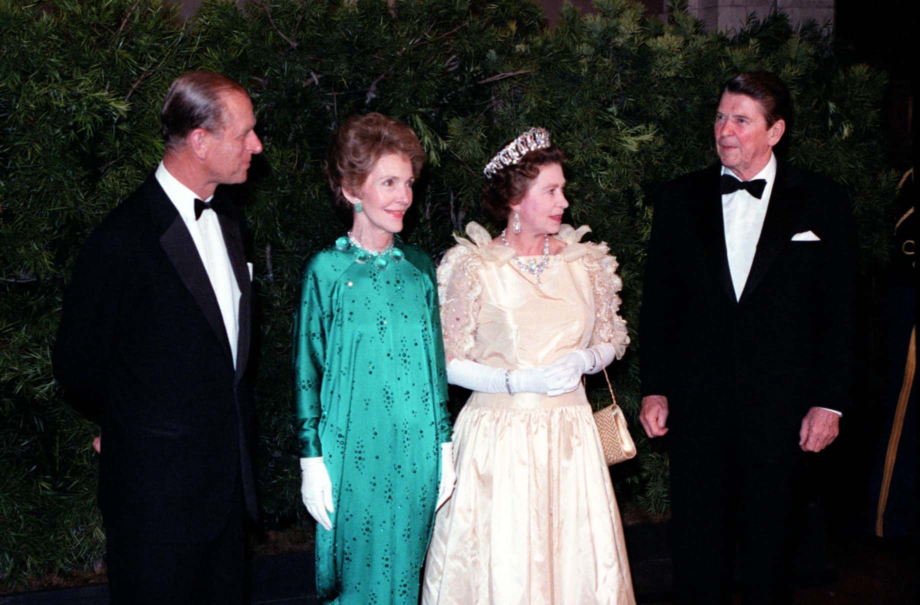 Queen Elizabeth II and Prince Philip stand with President and Mrs. Reagan