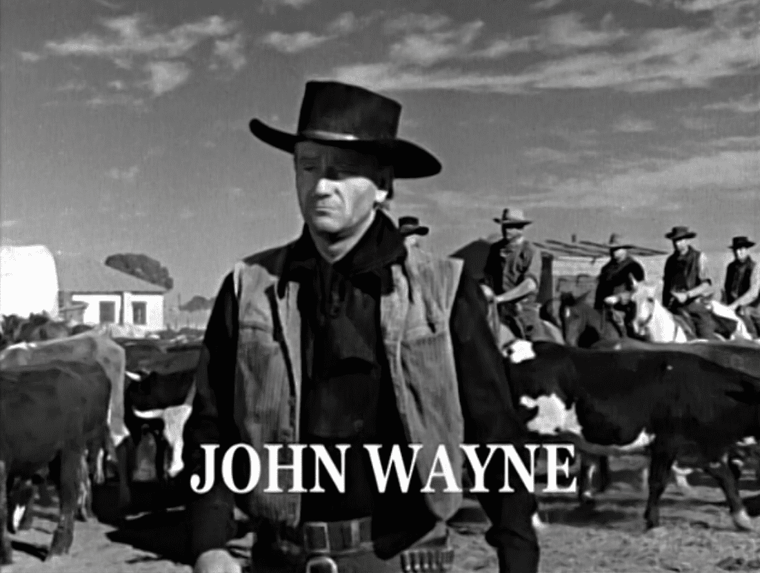 Portrait Photo of the actor John Wayne from the movie Red River, wearing cowboy hat and cowboy outfit