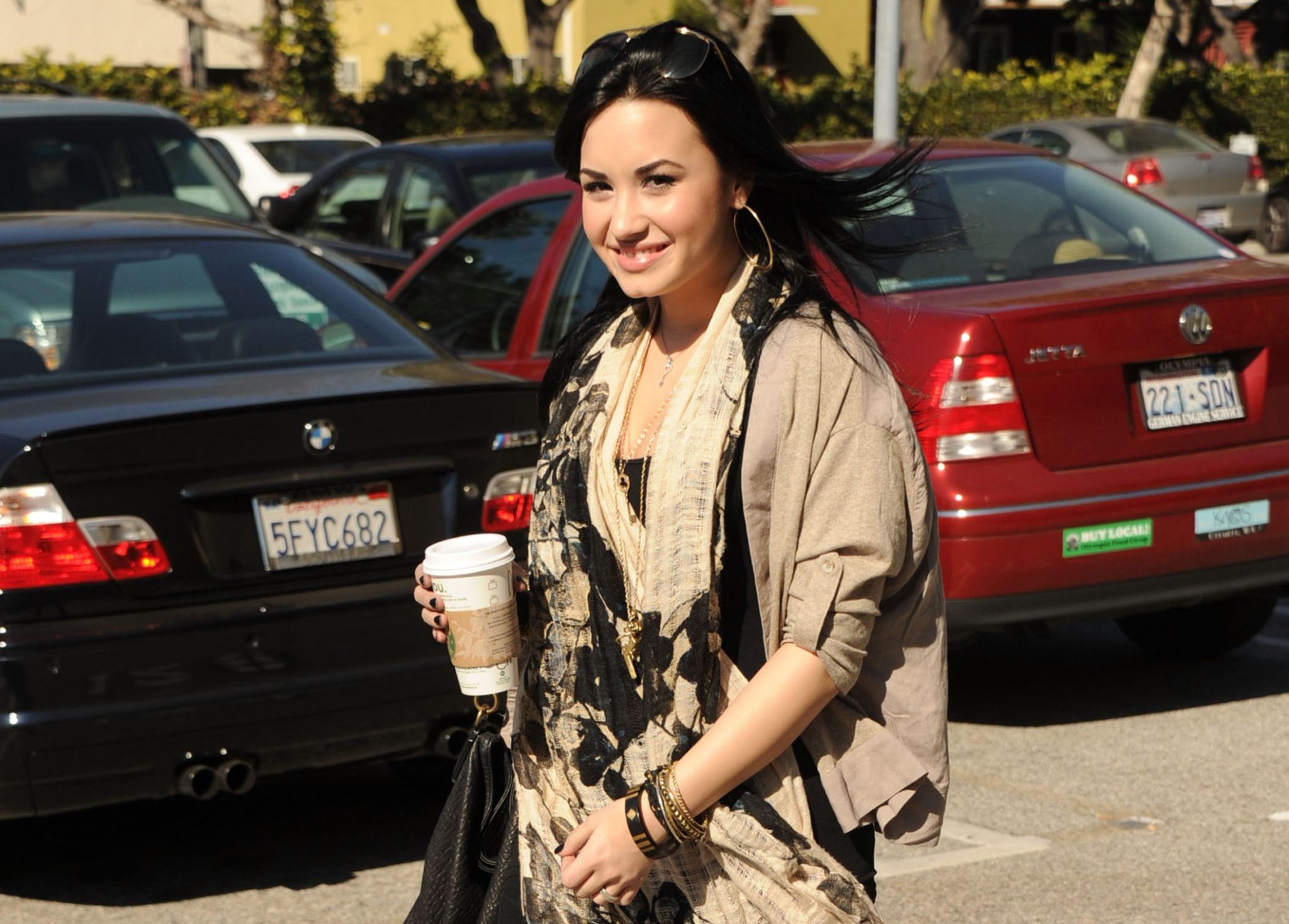 Demi Lovato holding a cup of coffee