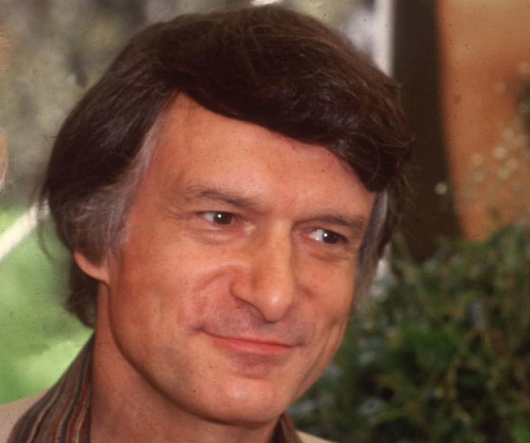 Hugh Hefner looking at side - 1980