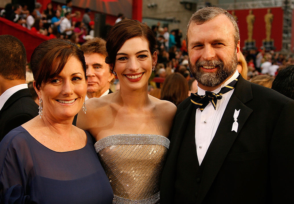 Actress Anne Hathaway (C) with her parents Kate McCauley and Gerard Hathaway