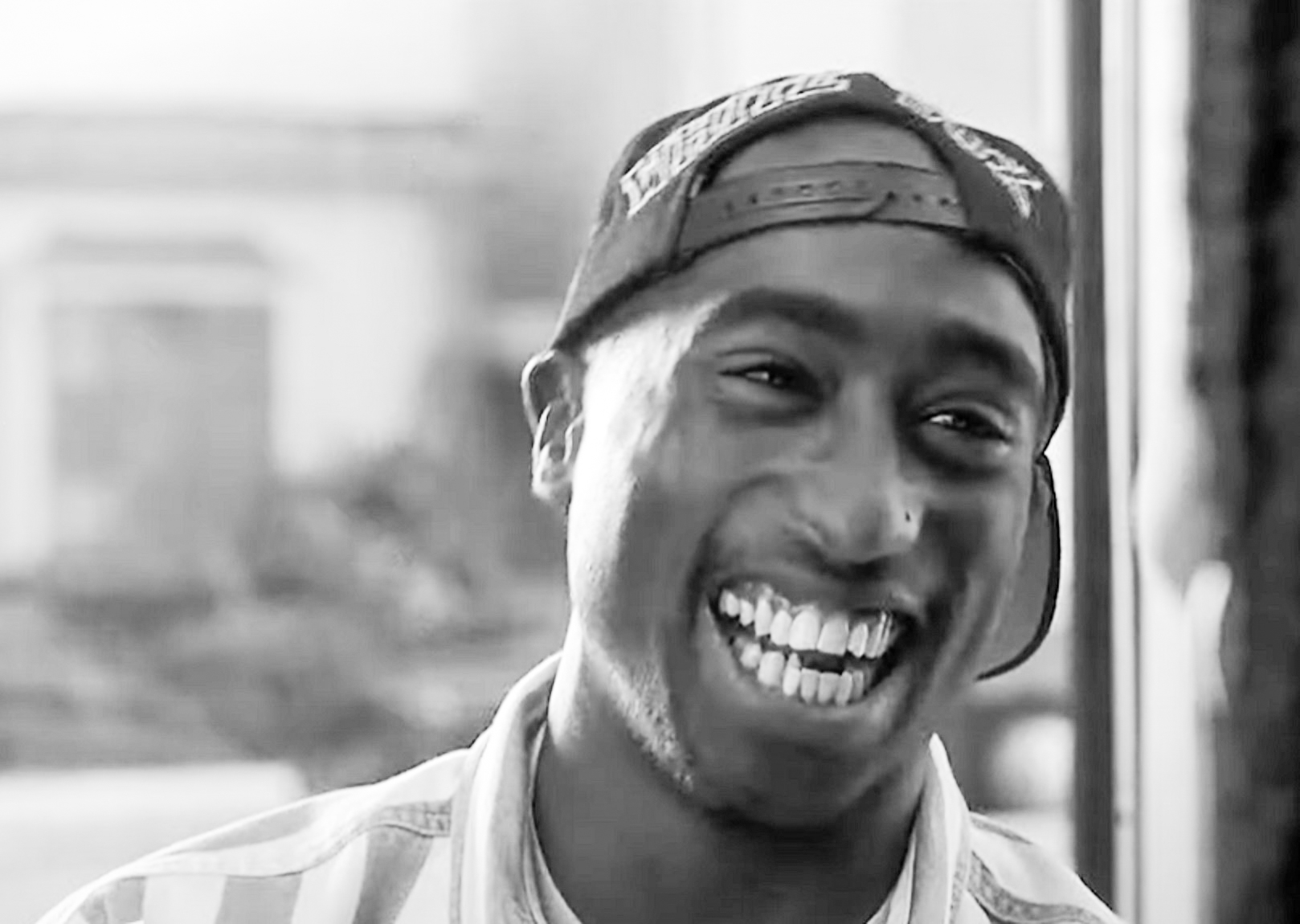 Screenshot of Tupac Shakur smiling