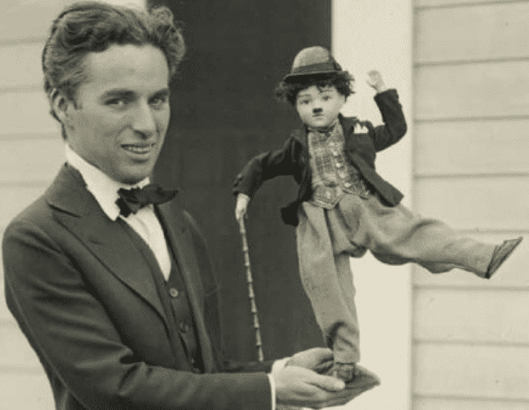 Charlie Chaplin with doll