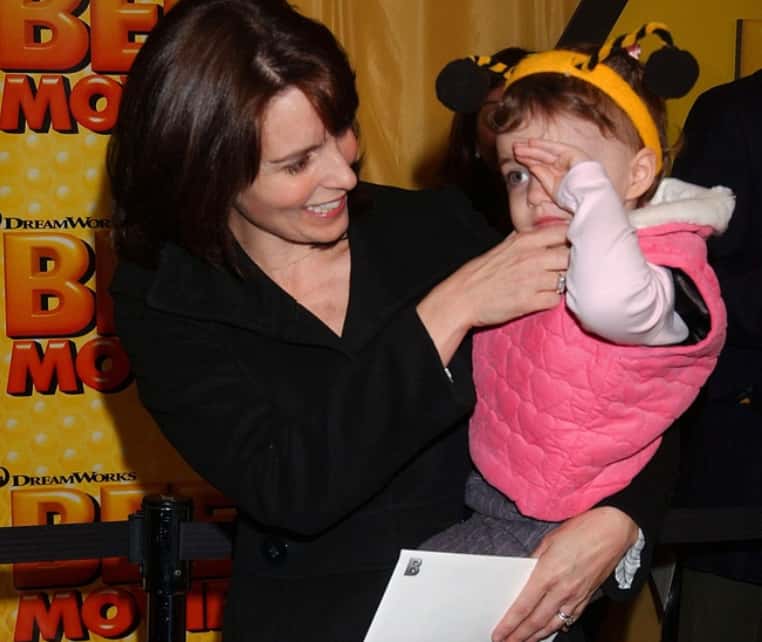 Tina Fey holding a little girl
