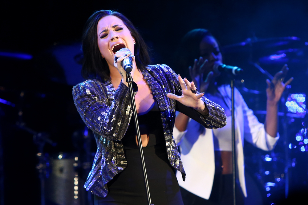 Recording artist Demi Lovato performing