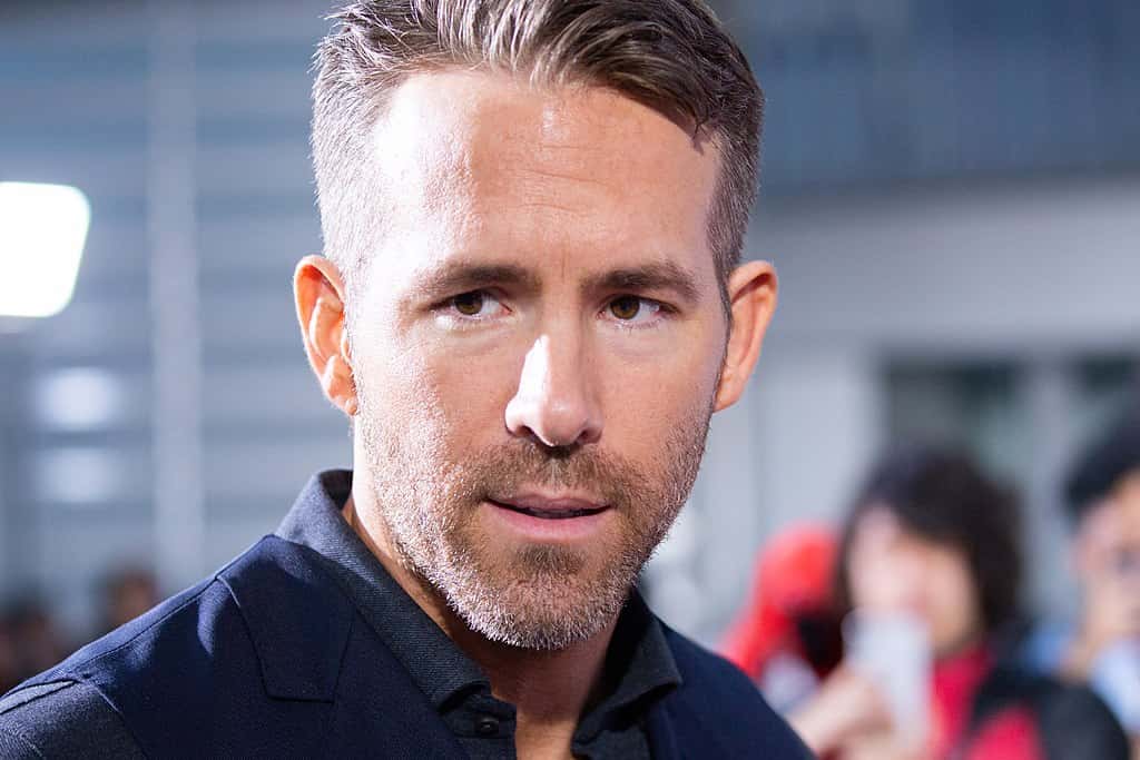 Ryan Reynolds wearing navy shirt
