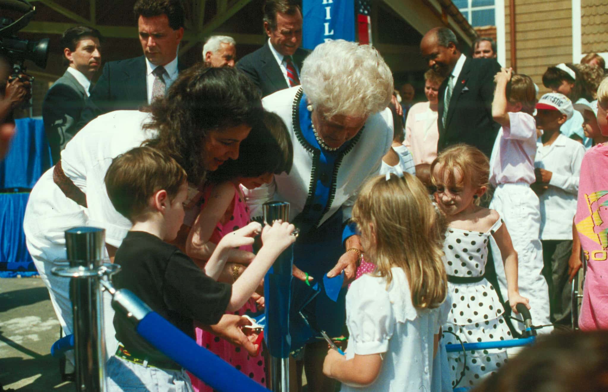 First Lady Barbara Bush cuts the ribbon to open the Children's Inn
