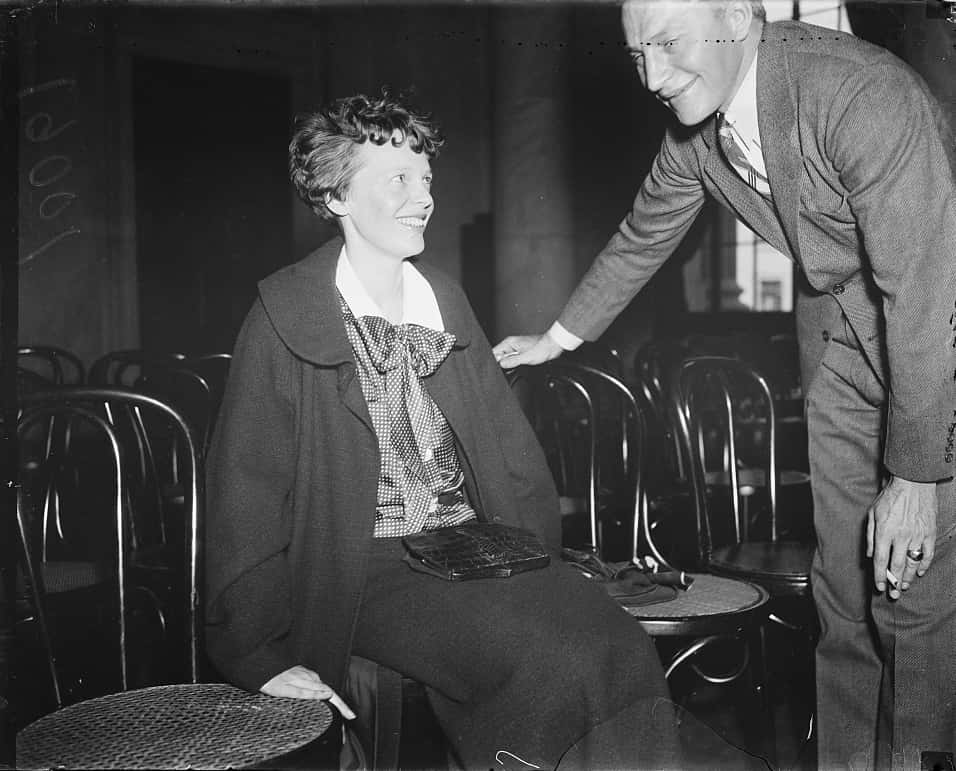 Amelia Earhart wearing a black coat