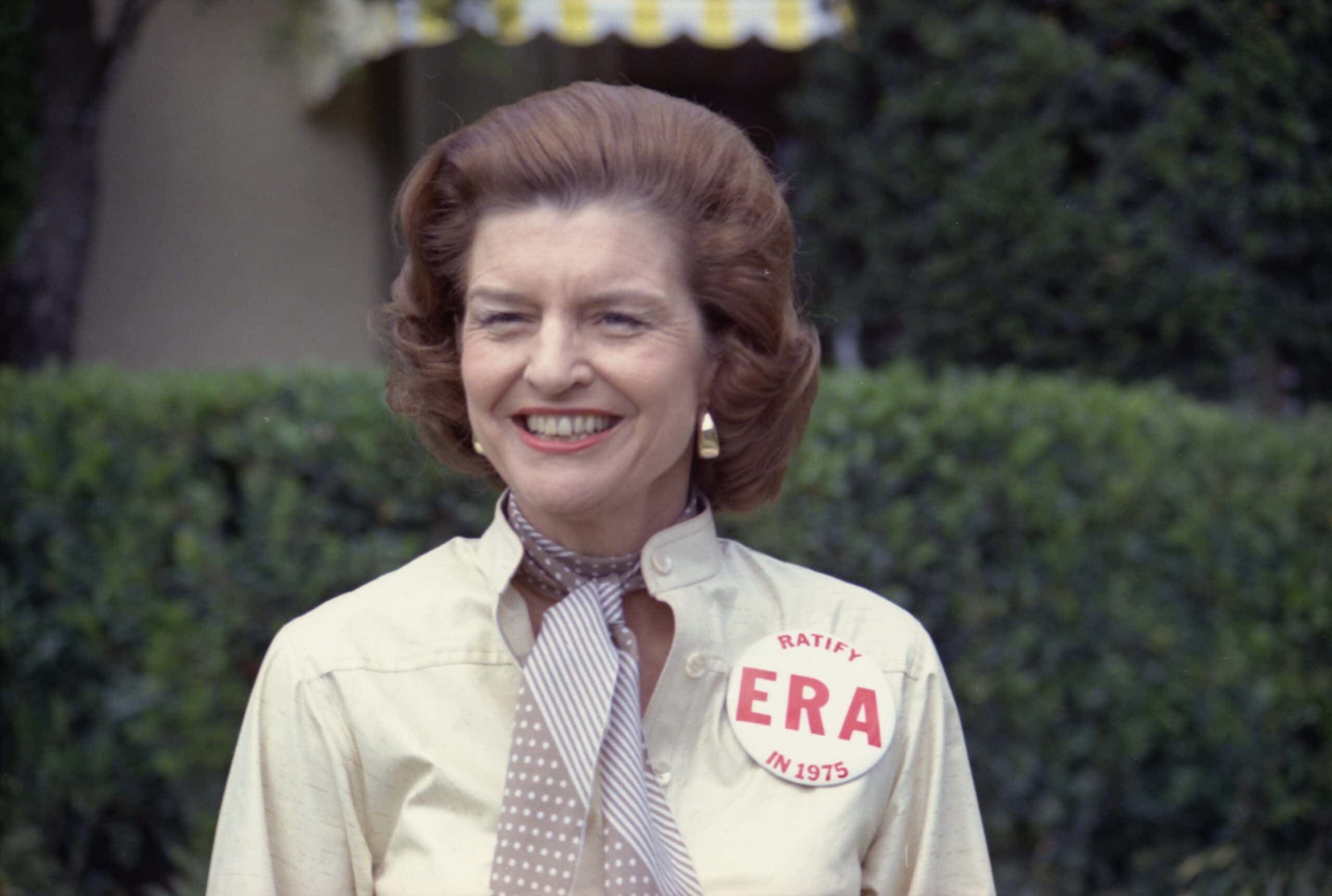First Lady Betty Ford sports a button expressing her support for ratification of the Equal Rights Amendment