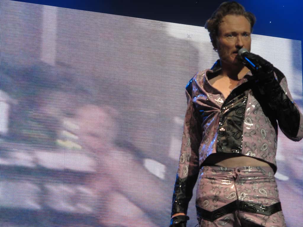 Conan O'Brien performing in a replica of the suit worn by Eddie Murphy in Eddie Murphy Raw