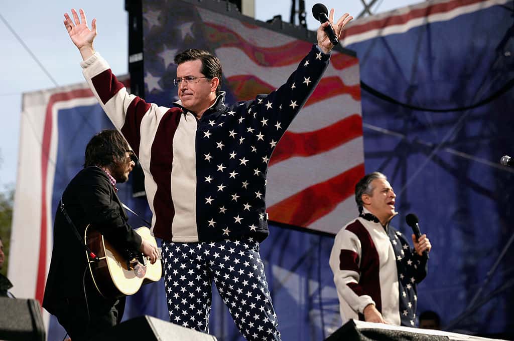 Comedians Stephen Colbert and Jon Stewart 'sing' during the Comedy Central 'Restore Sanity And/Or Fear'