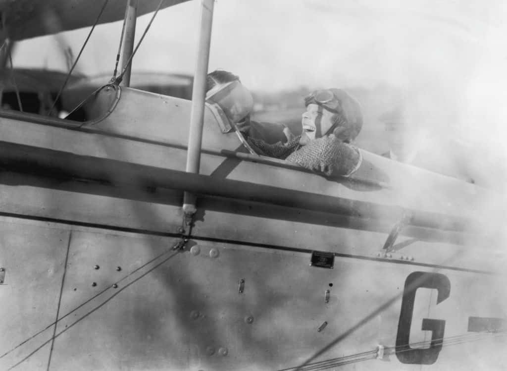American aviatrix Amelia Earhart laughs with joy during a trip to Northolt