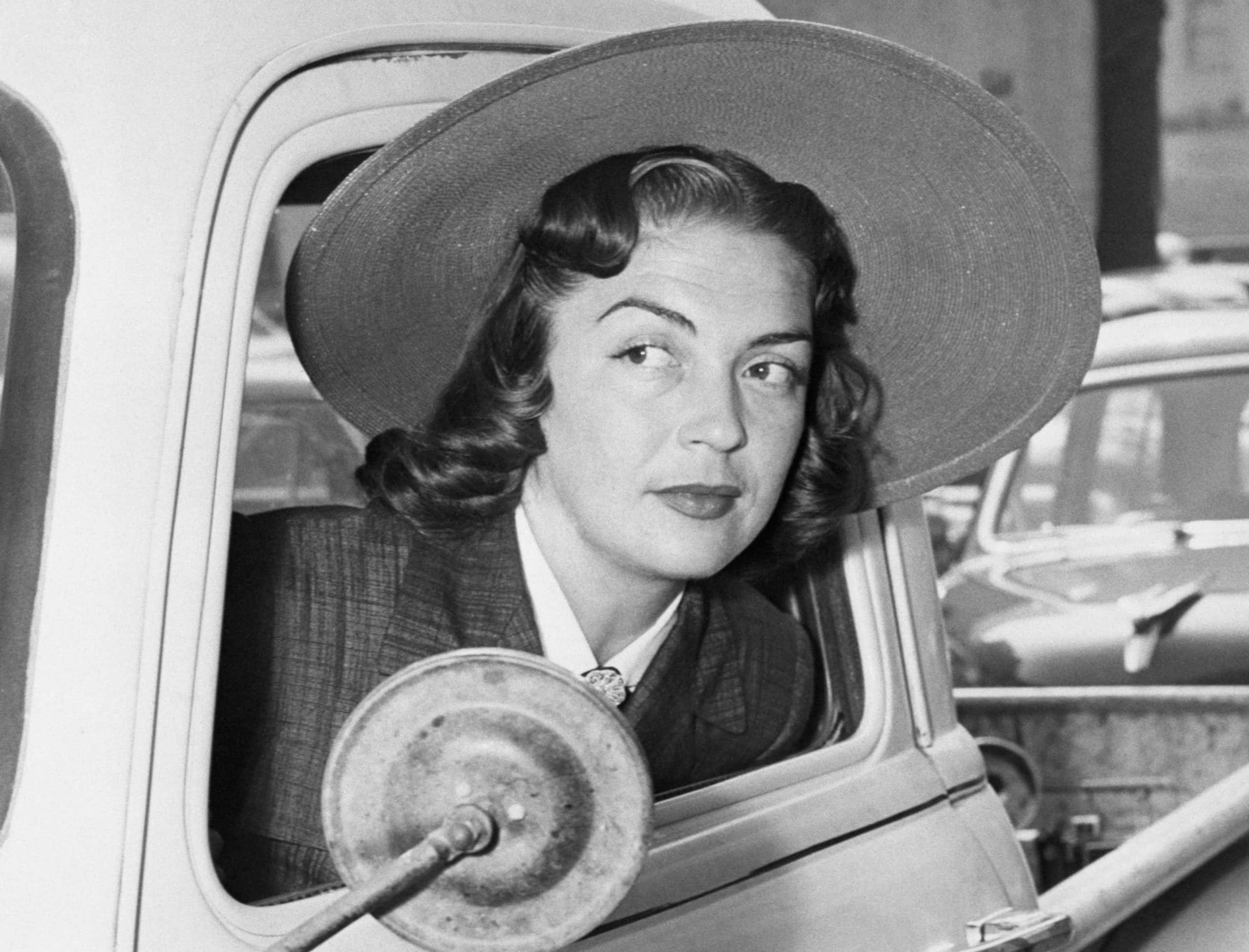 Mrs. Esperanza Baur Wayne, estranged wife of actor John Wayne, arrives in front of Hollywood's Superior Court, wearing a big hat