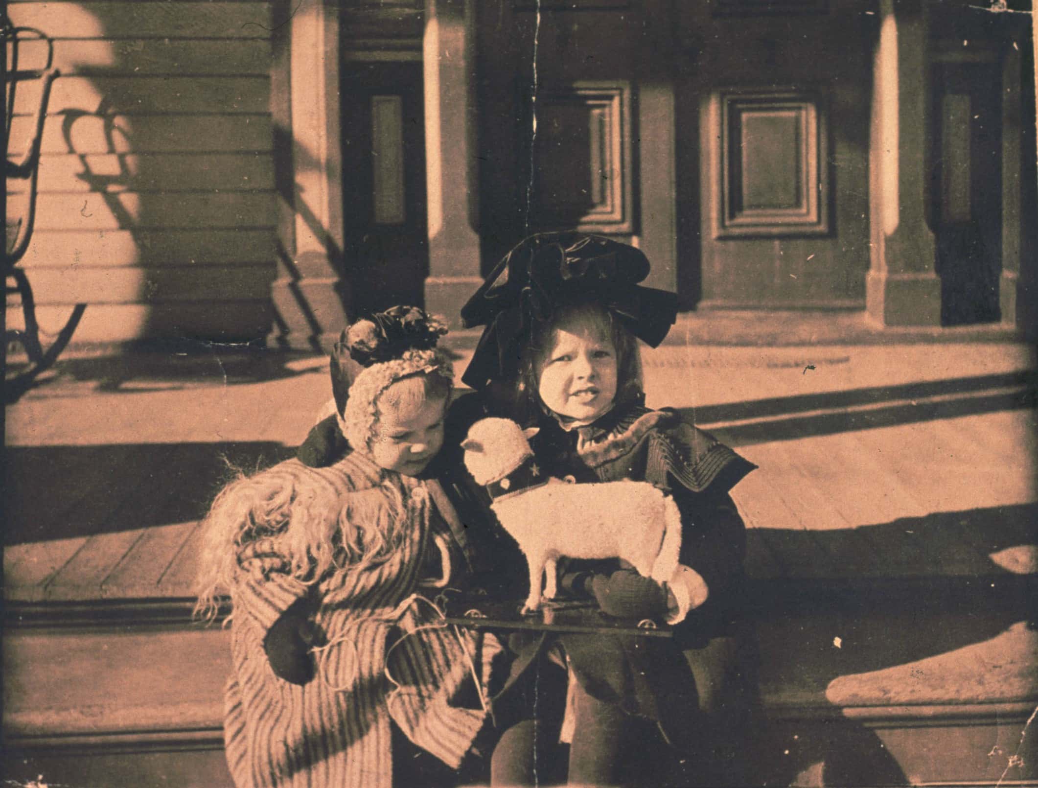 Baby picture of pilot Amelia Earhart with a dog