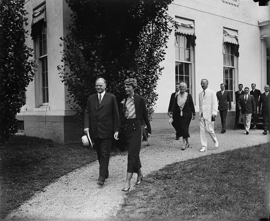 Herbert Hoover and Amelia Earhart walking at White House, Washington, D.C.
