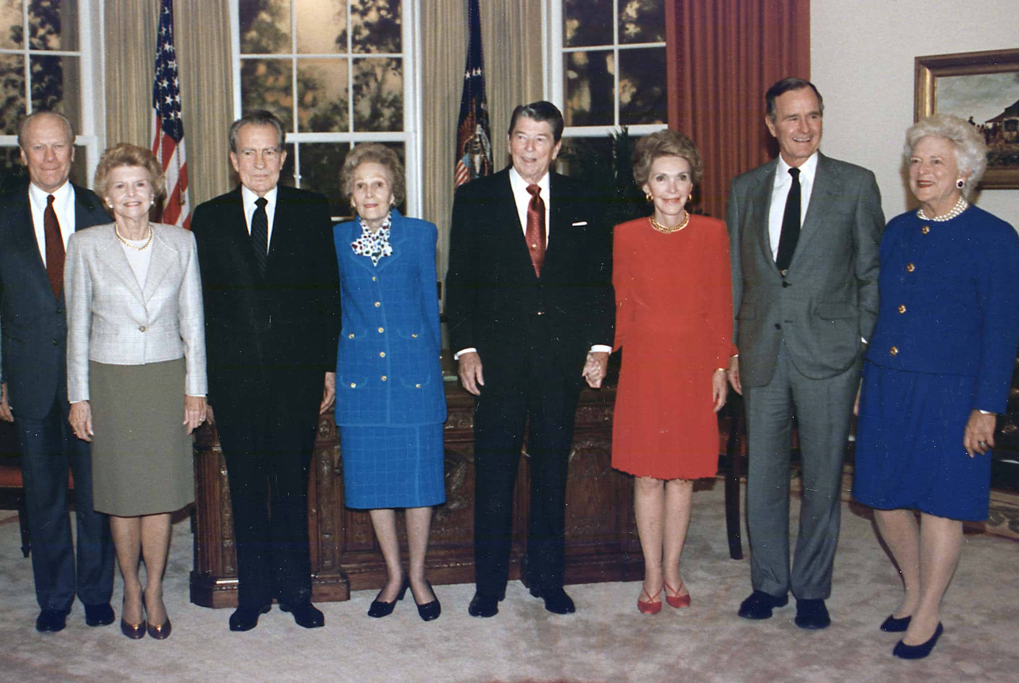 President and Mrs. Bush pose with the former presidents and first ladies in the replica of the Oval Office