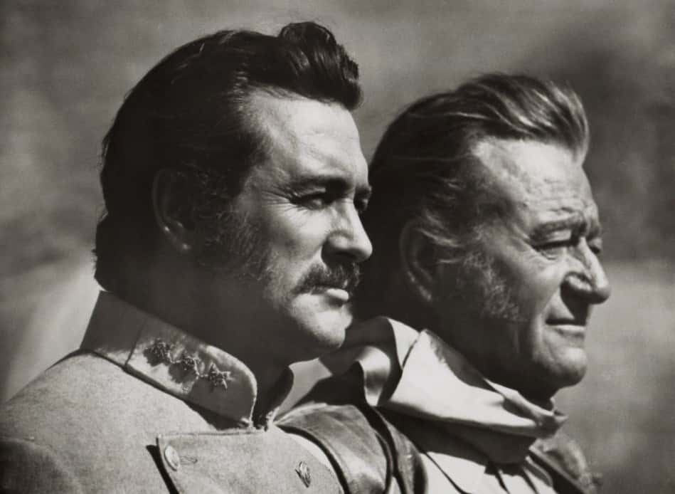 Rock Hudson (and John Wayne in The Undefeated, standing next to each other