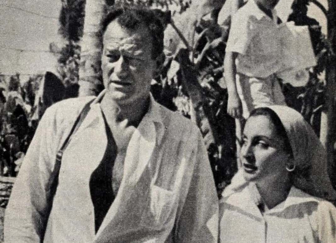  John Wayne with his third wife Pilar Pallete wearing white shirts
