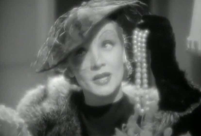 Screenshot from the movie Seven Sinners, Marlene Dietrich wearing glamorous hat