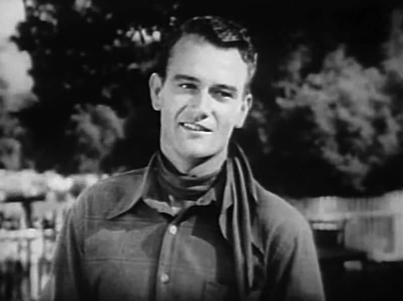 Portrait Photo of the actor John Wayne, wearing cowboy outfit