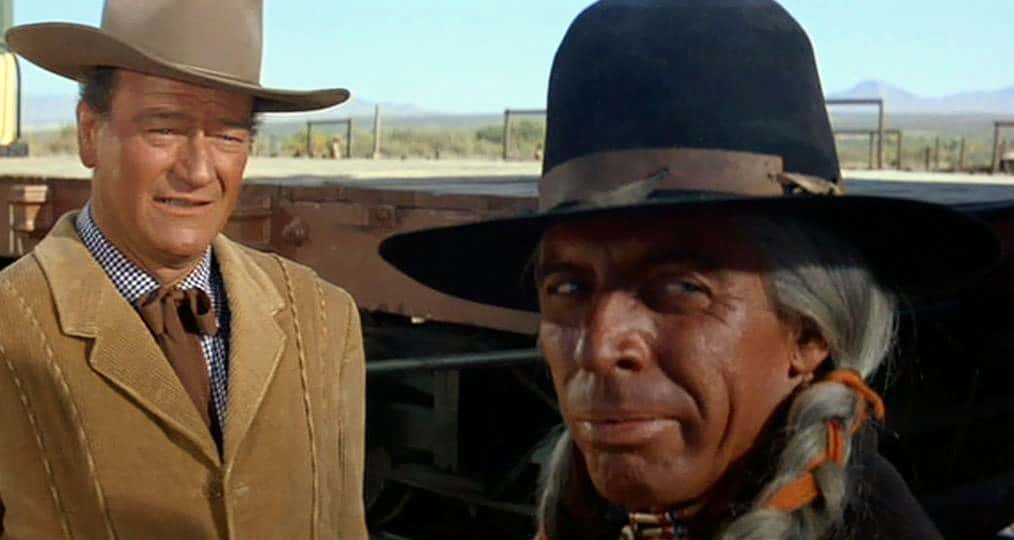 John Wayne and Michael Pate in the Movie McLintock! facing the camera